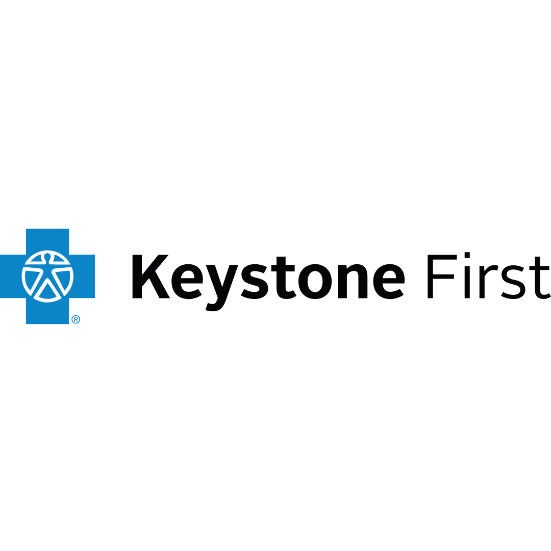 Keystone First logo: Blue cross with an emblem, text