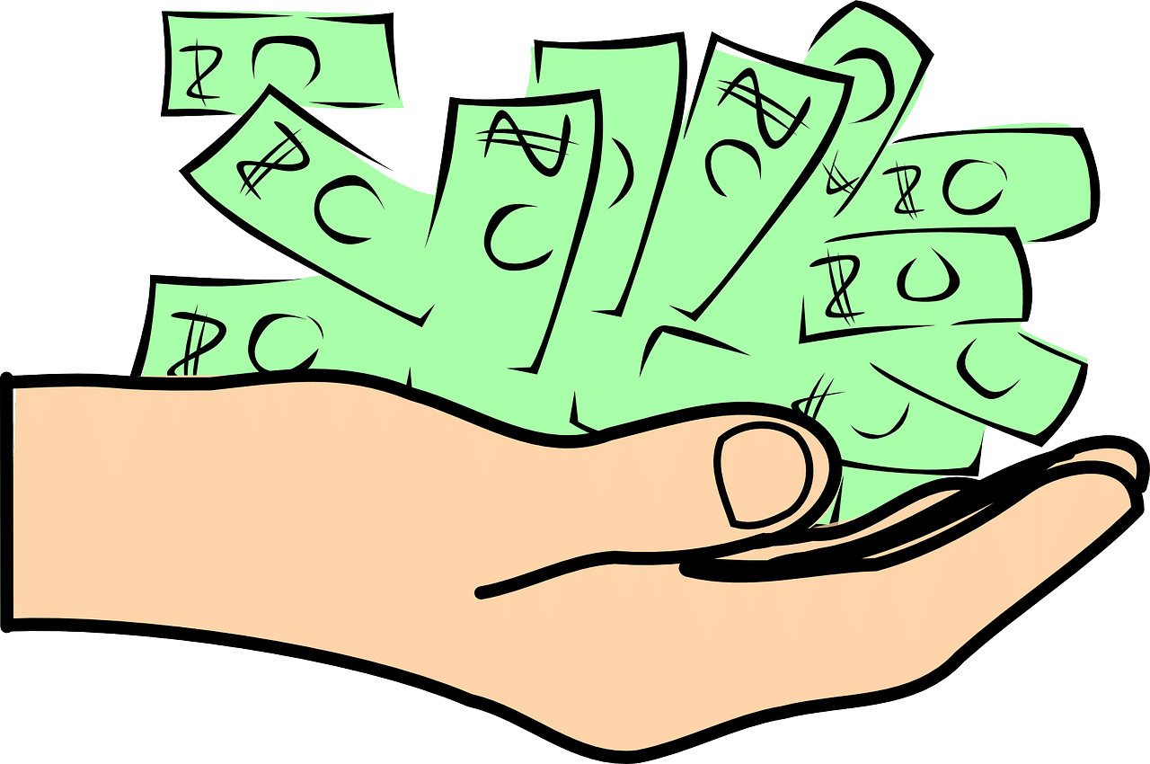 Hand holding a large stack of green cash.