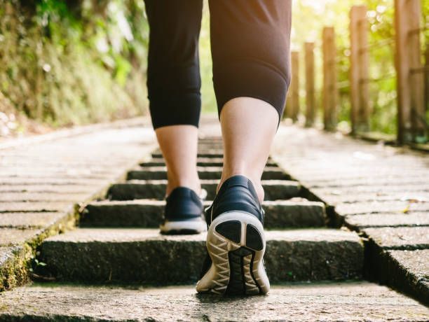 A person is walking up a set of stairs.