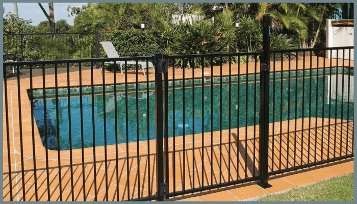 Black aluminium pool fencing around a backyard swimming pool in Canberra, offering durability, safety, and low-maintenance practicality.