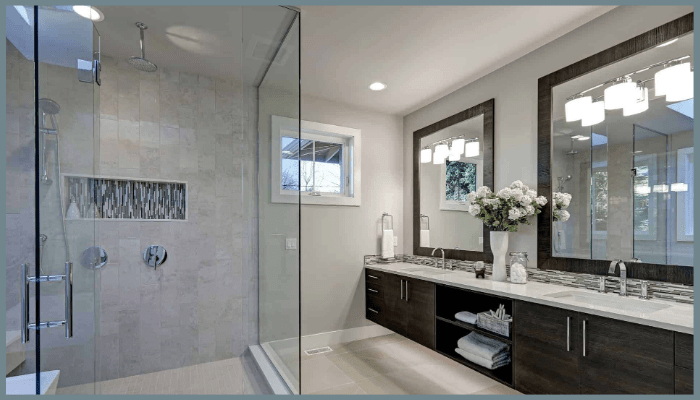 Modern Canberra bathroom featuring a frameless glass shower screen, double vanity, and minimalist design with bright lighting.