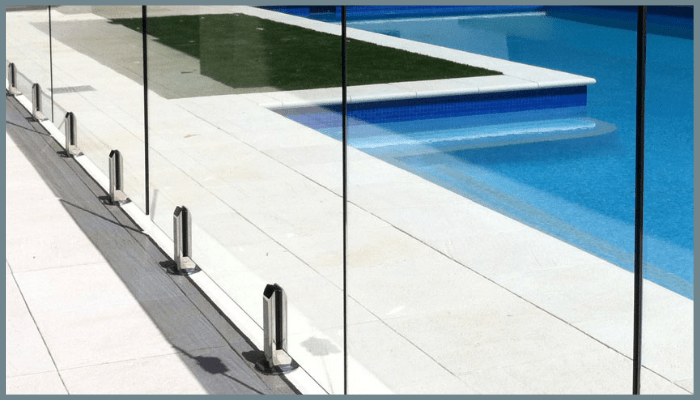 Frameless glass pool fence with spigots installed in Canberra, meeting Australian Standards for pool safety compliance