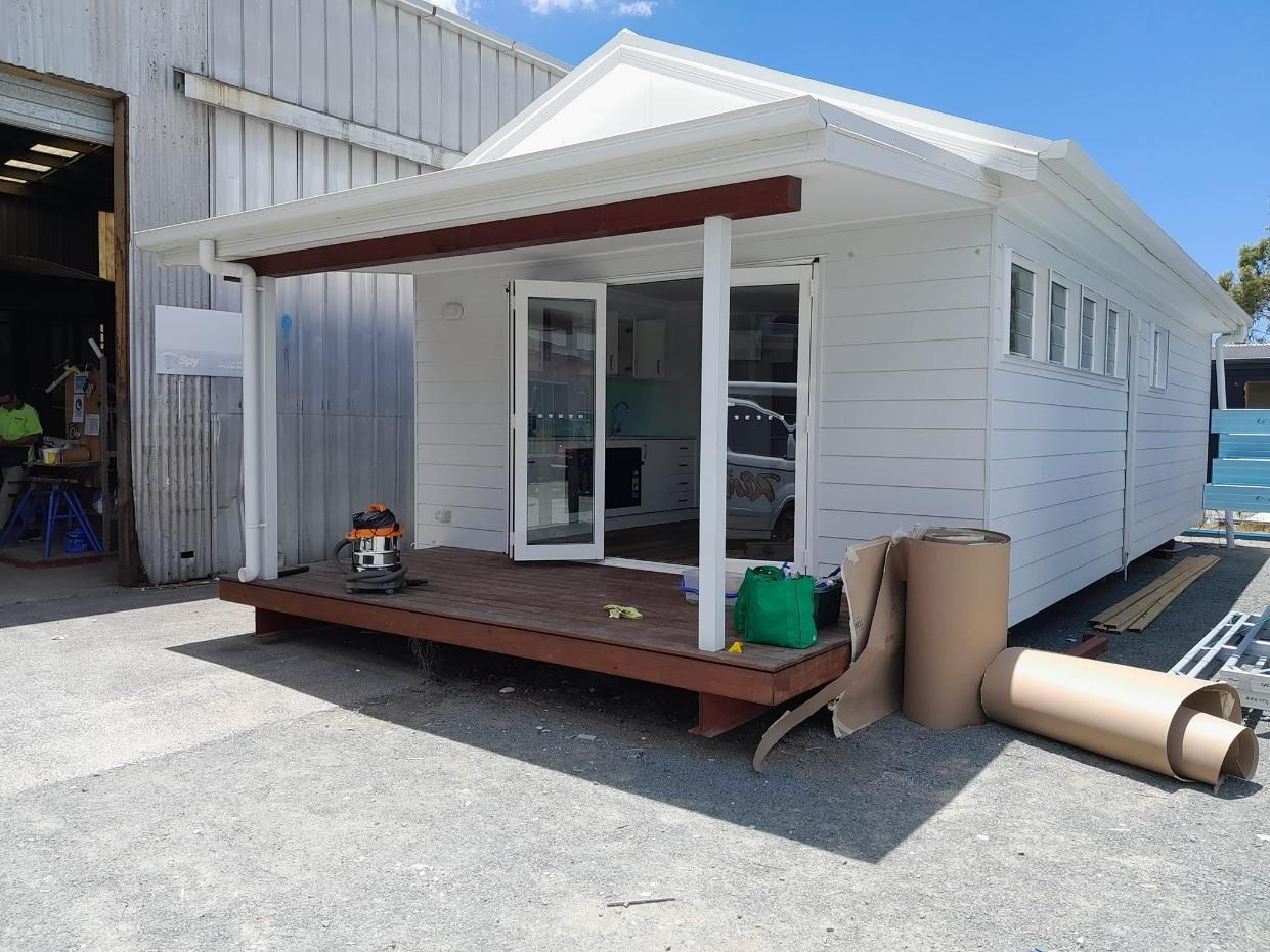 A Small White House with A Porch Is Being Built — Nano2go in Birtinya, QLD