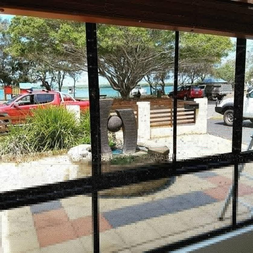 A View of A Park from A Window with Cars Parked in The Background — Nano2go in Birtinya, QLD