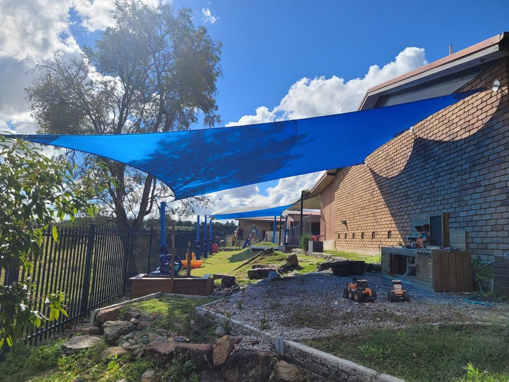 Blue Colour Shade Sails On The Backyard — Smart Shades Lismore NSW