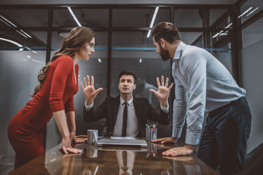 A Couple Arguing In Front Of A Lawyer - Queensland Lawyers in Cairns QLD