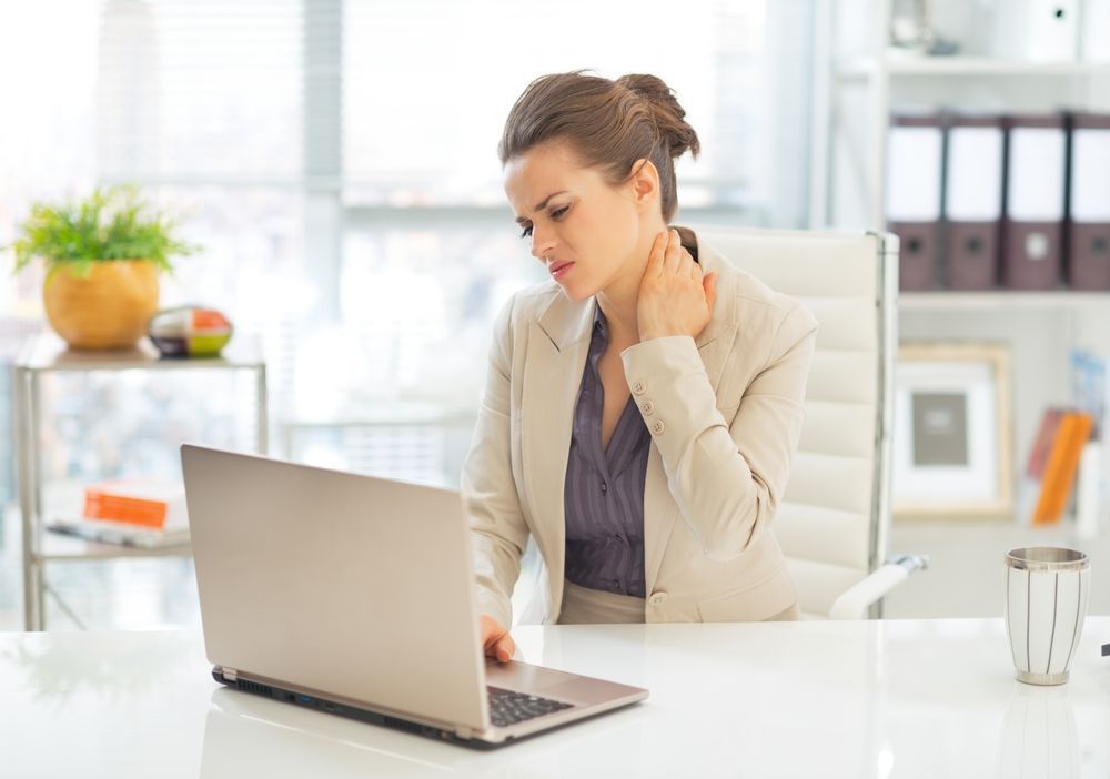 A Woman Who Looks Worried Looking At Her Computer — Queensland Lawyers Cairns In Cairns City, QLD