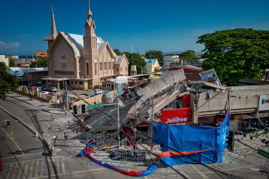 Earthquake damage in Mindanao, Philippines, showing collapsed structures and disaster recovery needs