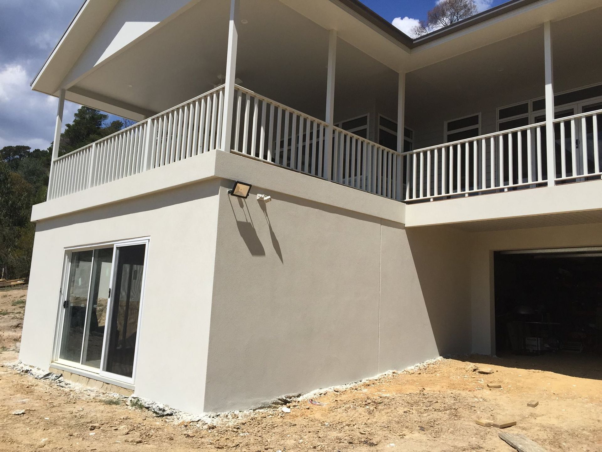 A White House With A Balcony And A Garage – Dandenong, VIC - Pearl Rendering Services