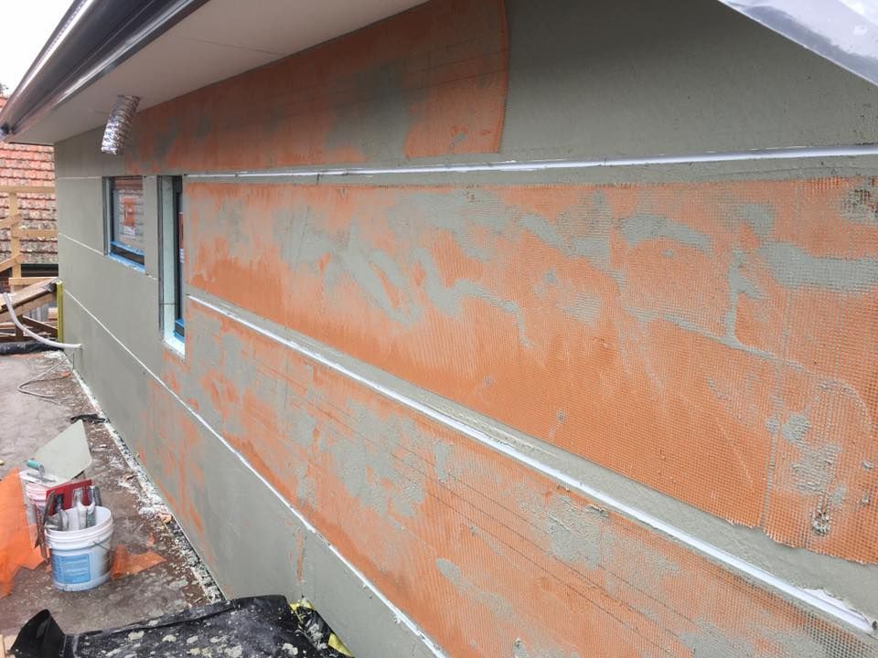 A House Is Being Painted With A Gray And Orange Color Scheme – Dandenong, VIC - Pearl Rendering Services