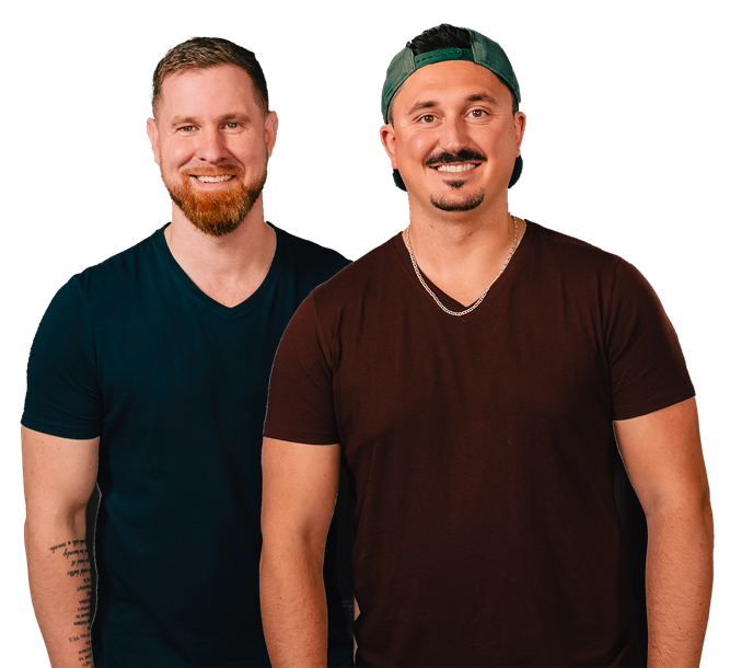 Two men are standing next to each other and smiling for the camera.