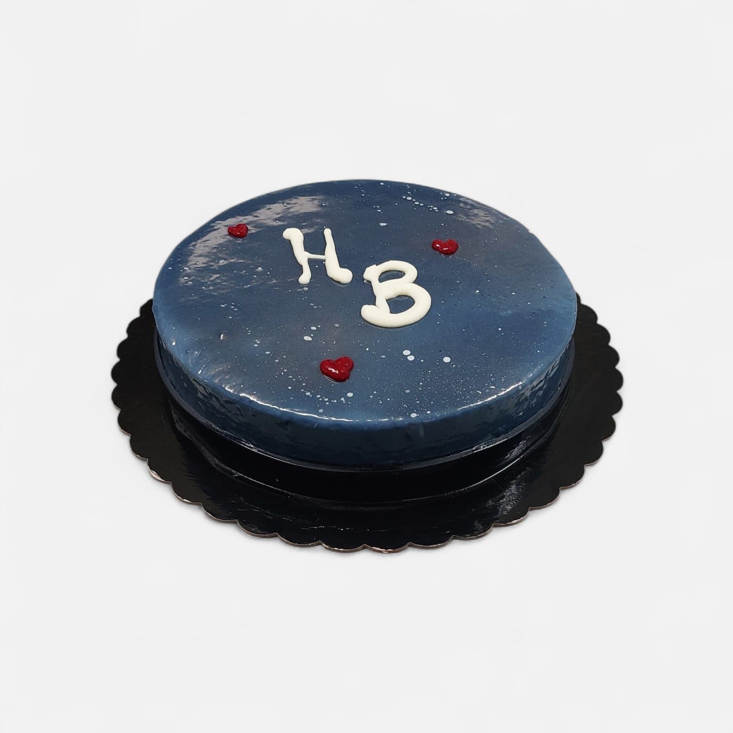 Torta glassata blu con decorazioni 