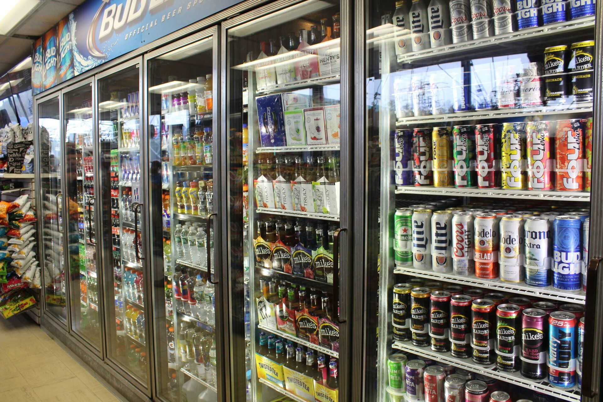 A grocery store filled with lots of cans and bottles of beer.