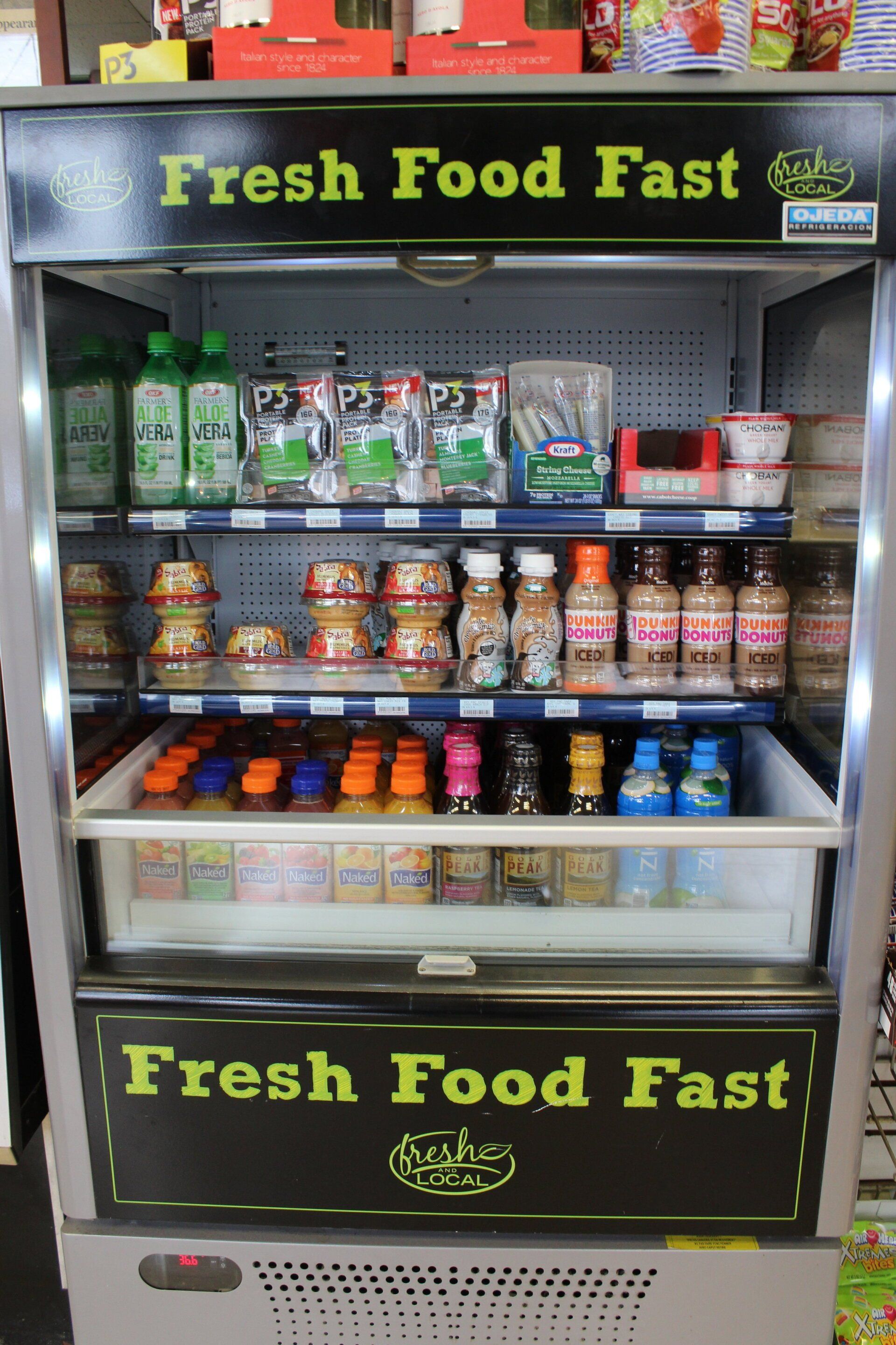 A refrigerator with a sign that says fresh food fast