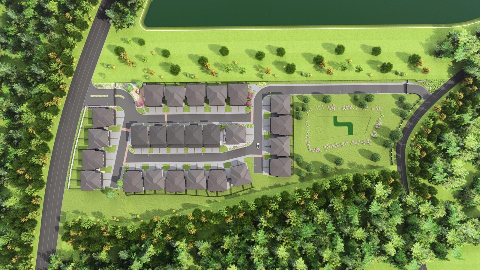 Aerial view of a planned residential community with rows of houses, roads, and a green area with trees.