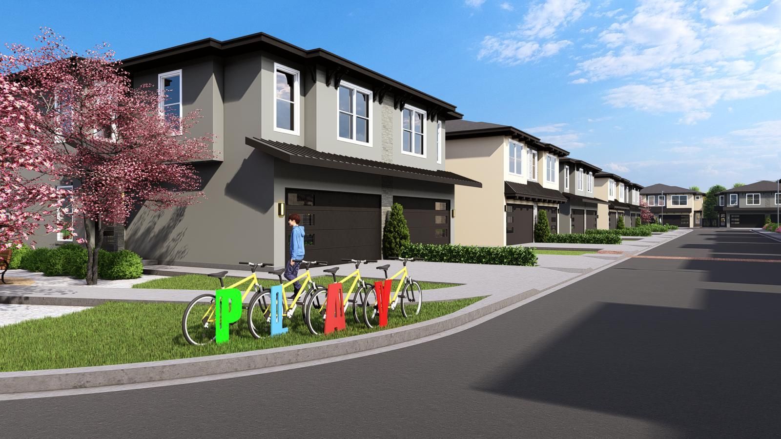 Row of townhouses with garages; bicycles parked on the sidewalk.