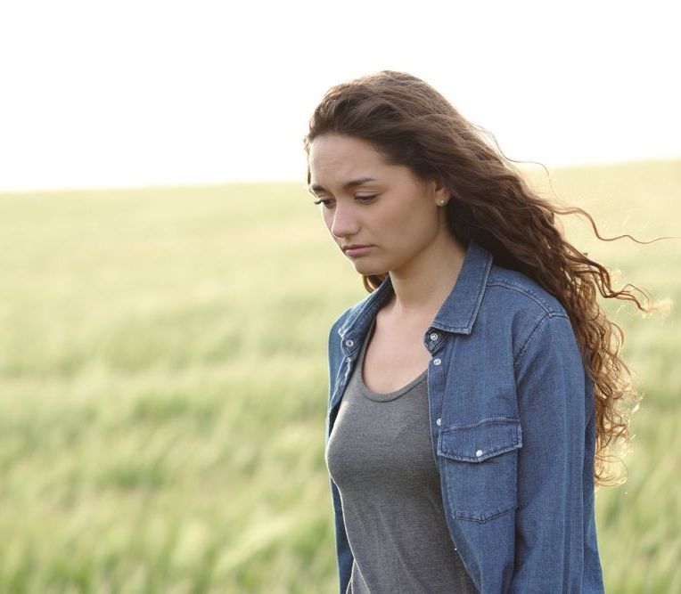 woman feeling unsettled in challenging times
