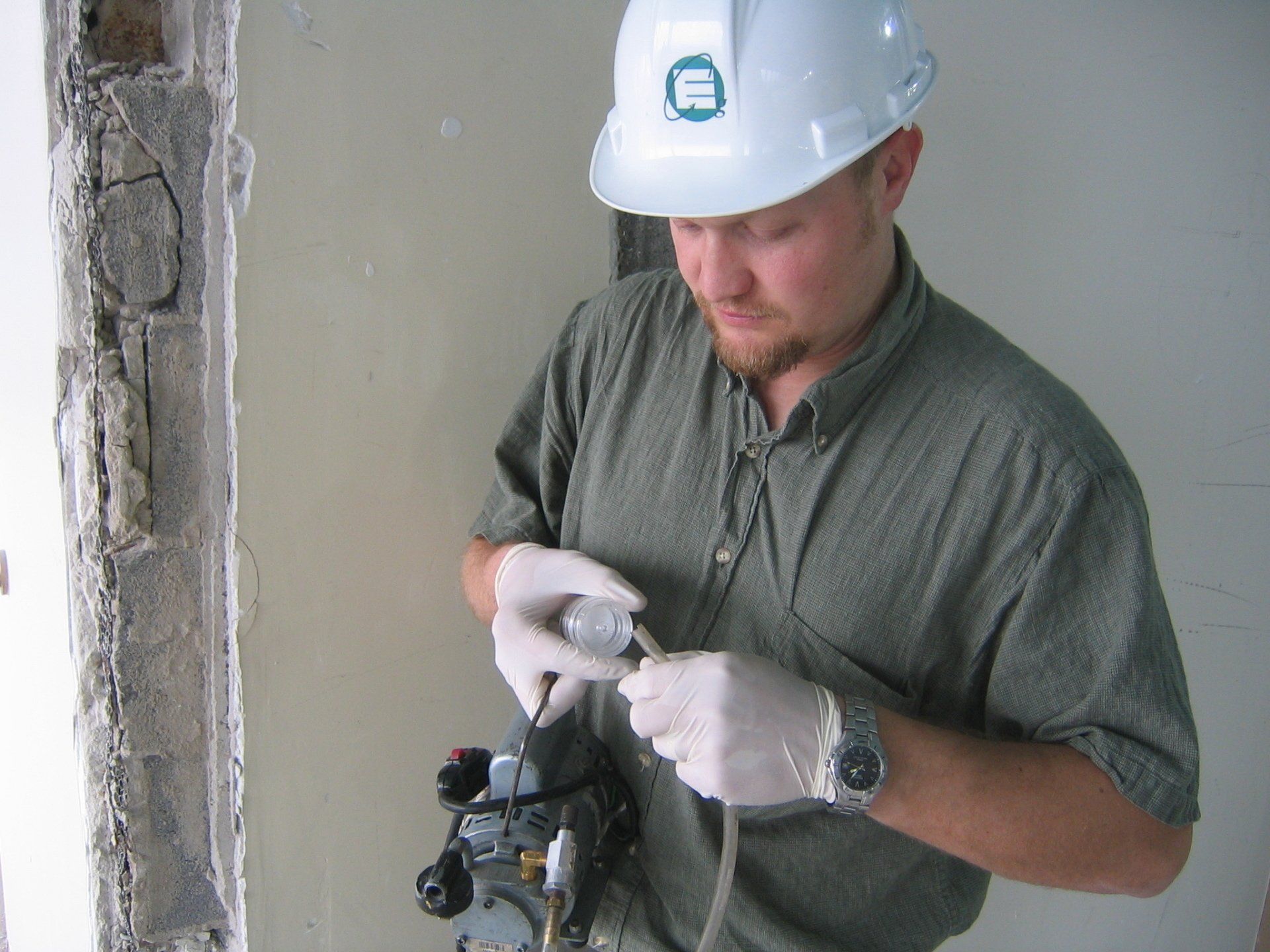 ECG employee conducting asbestos removal project