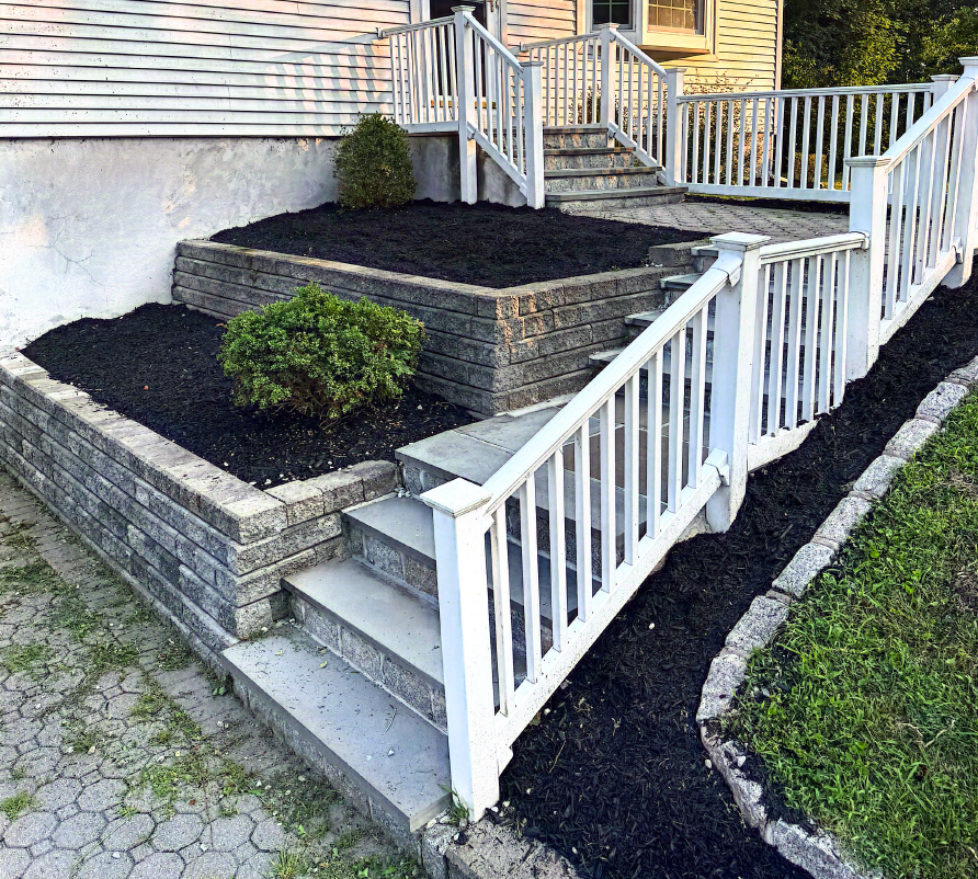 Workers installing drywall in a room with protective plastic sheeting.