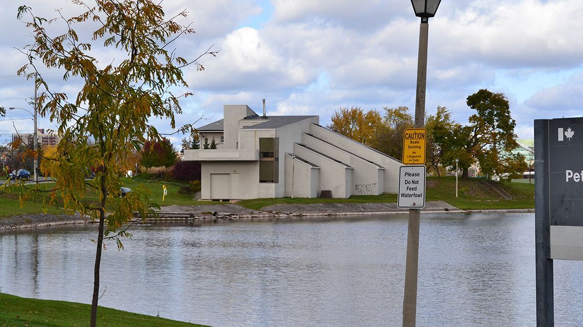 concrete building with a sloped roof