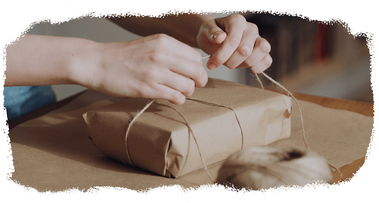 hands wrapping a gift