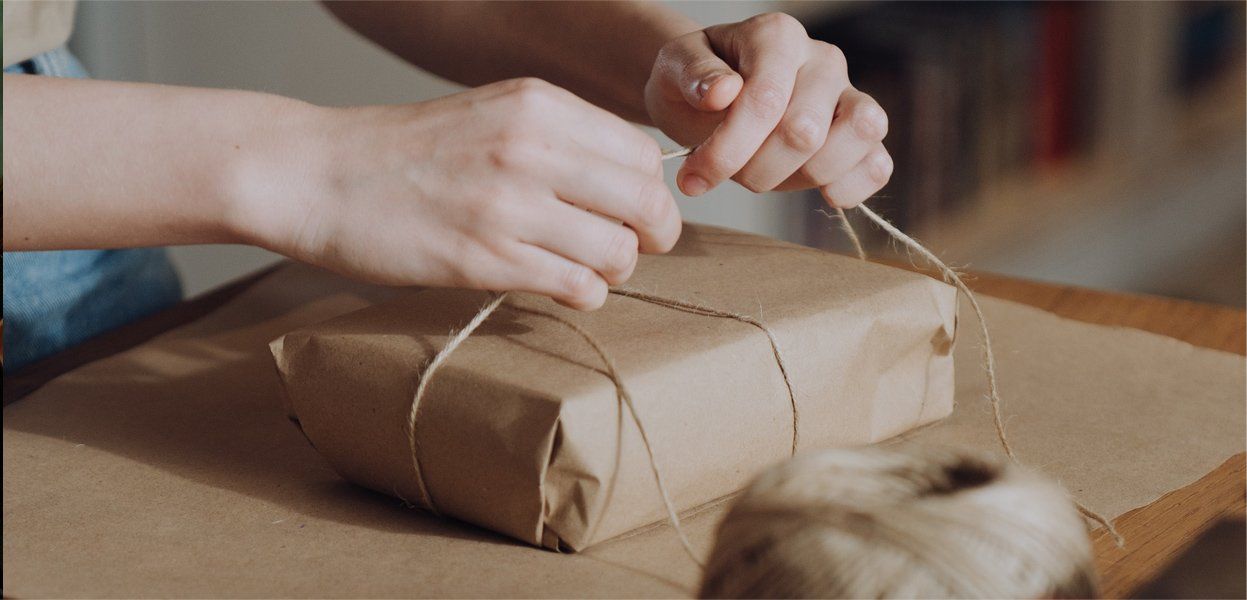 hands wrapping a present