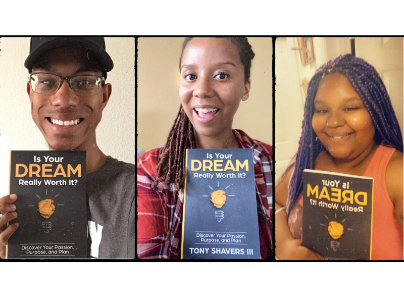 Three smiling young professionals holding Tony Shavers III's self help book - Is Your Dream Really Worth It?