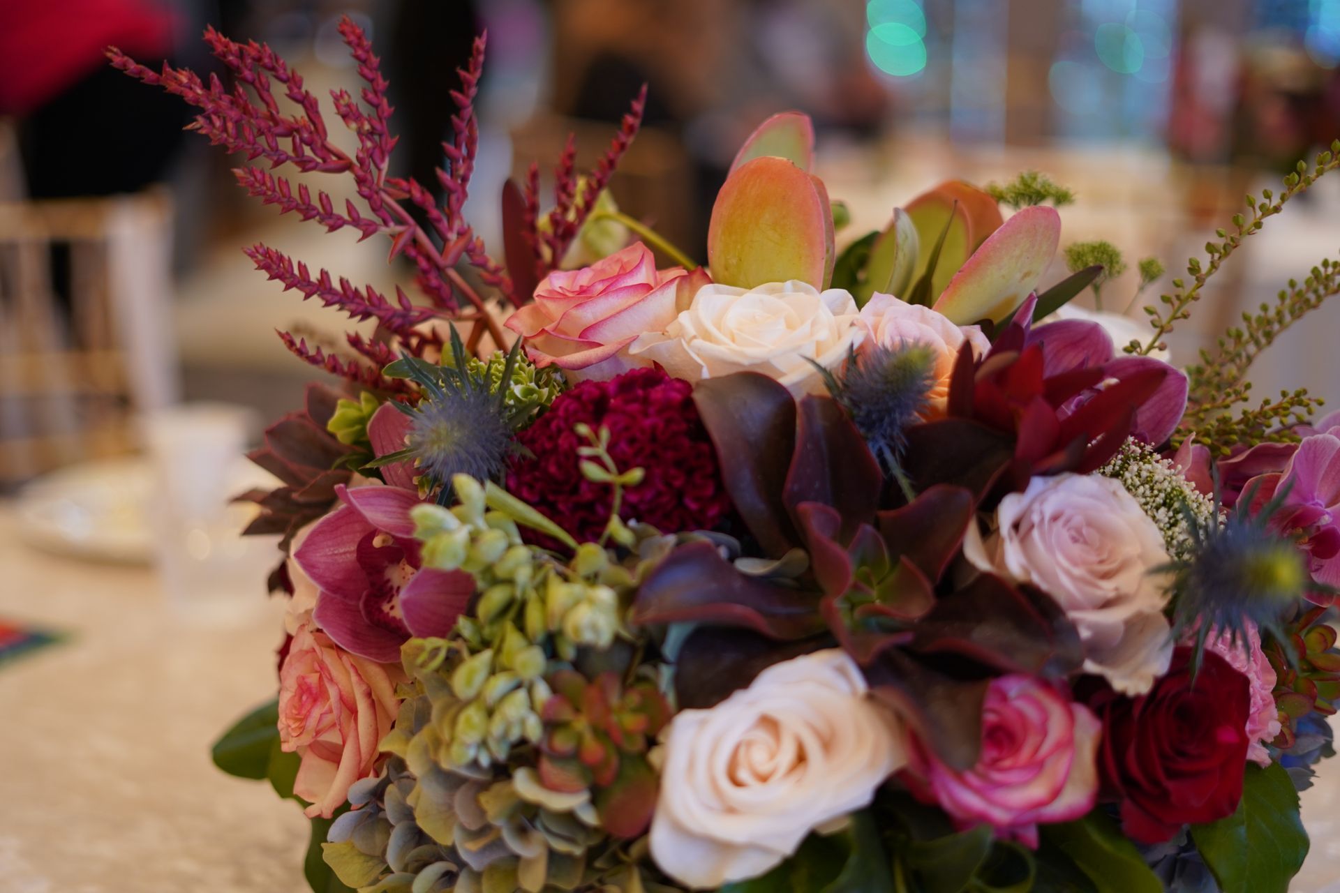 A bouquet of flowers is sitting on a table.