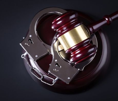 Wooden Judge Gavel And Police Handcuffs — Pocatello, ID — Debbie’s Bail Bonds
