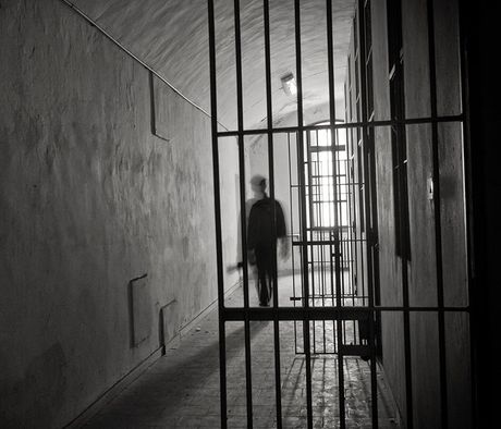 Inmate On Prison's Cell Door — Pocatello, ID — Debbie’s Bail Bonds