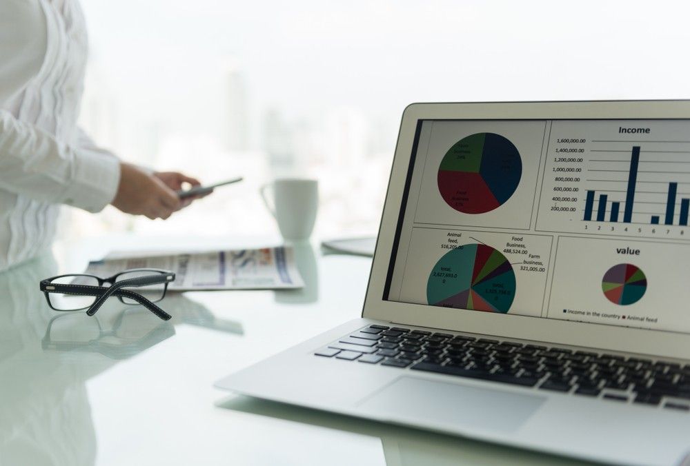 A Laptop Computer is Open to a Graph on the Screen — Rauseo Group in Humpty Doo, NT