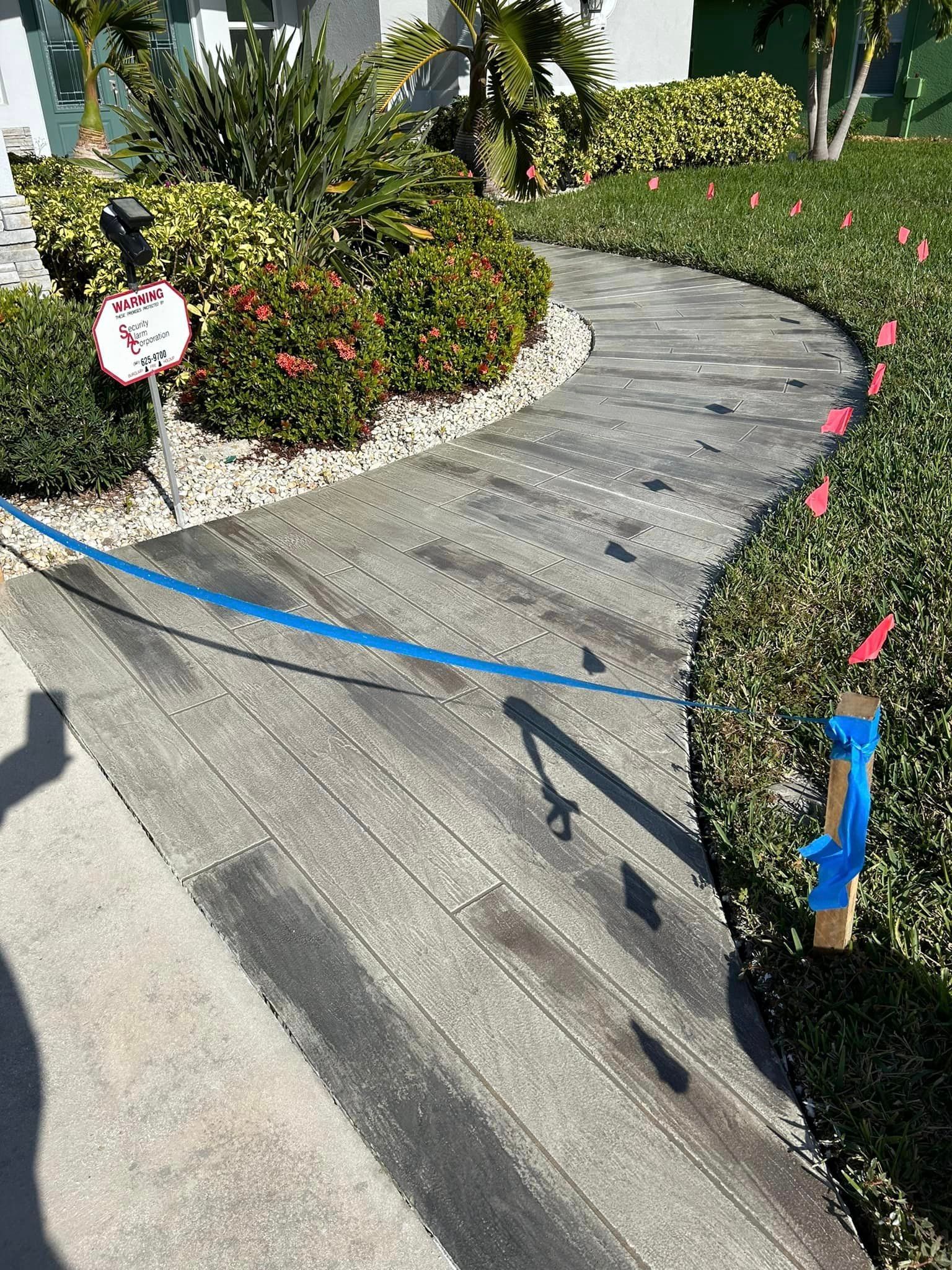 Decorative wood-look concrete walkway and sealant