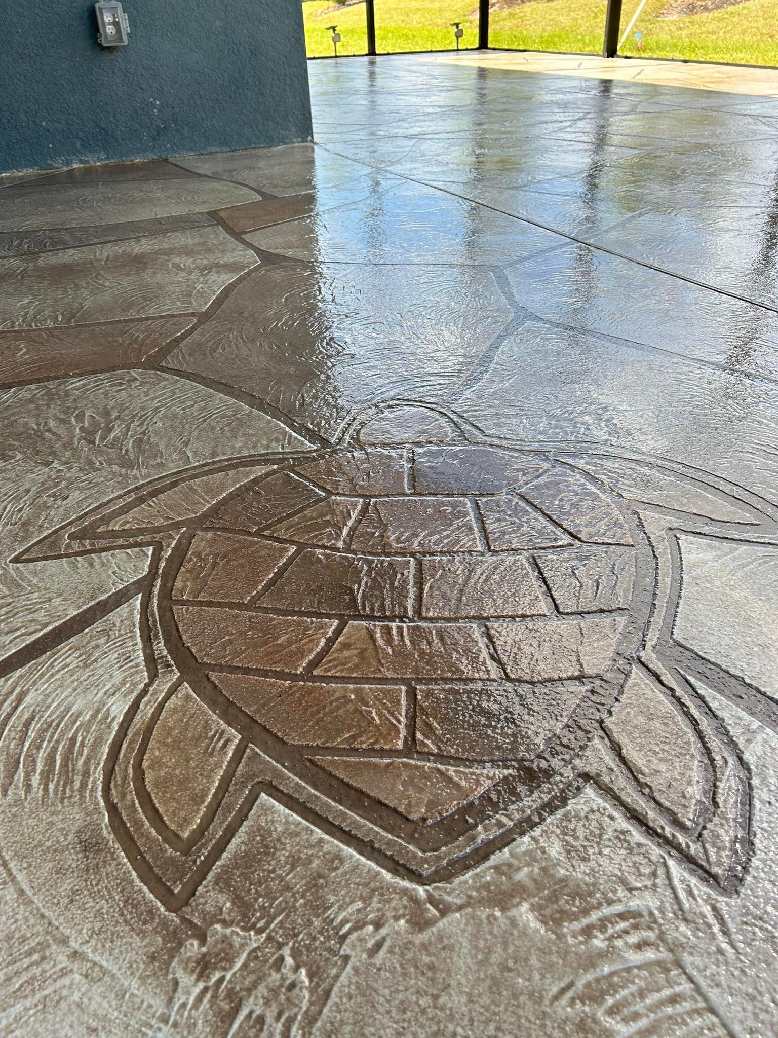 Elegant concrete design including a custom turtle stamped in