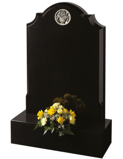 A prominent Black granite headstone with neatly defined chamfers. The ornate carving can be hand finished in Verdigris or Bronze paint effect. Alternatively leave the headstone plain.