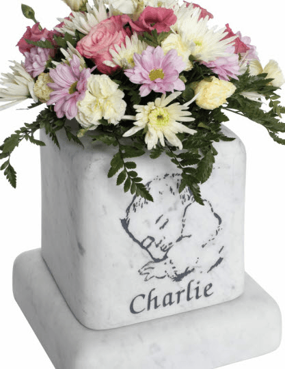 The cushioned edges to this marble vase create a gentle look.