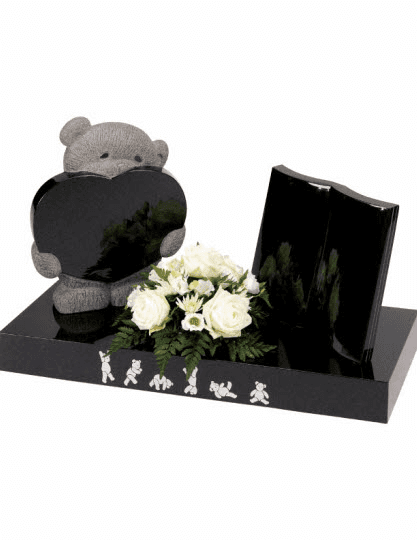 Tumbling Ted decorates the front of the base leaving both the delicately carved teddy with heart and free standing book available for inscriptions.