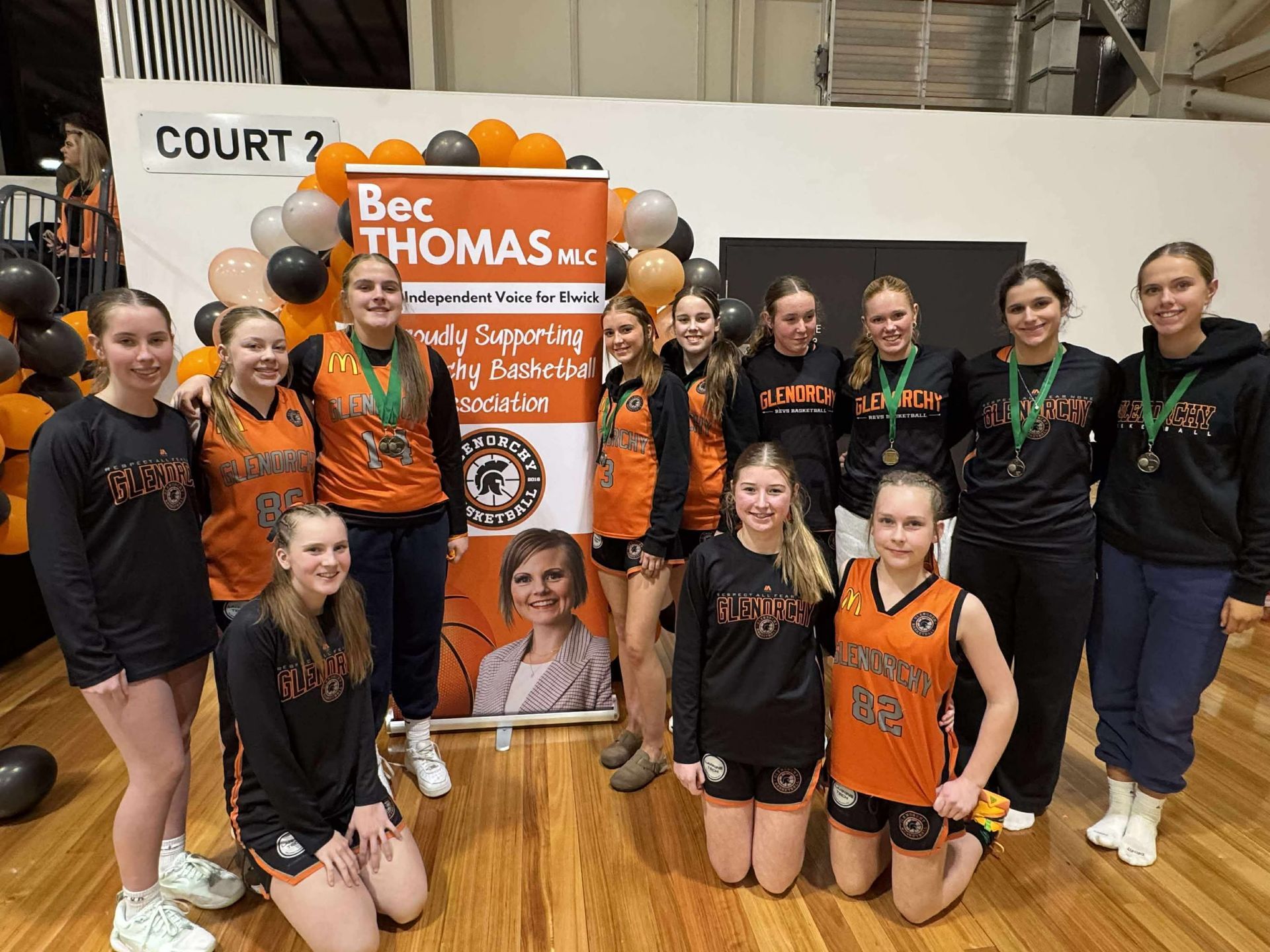 Bec Thomas banner with GBA members