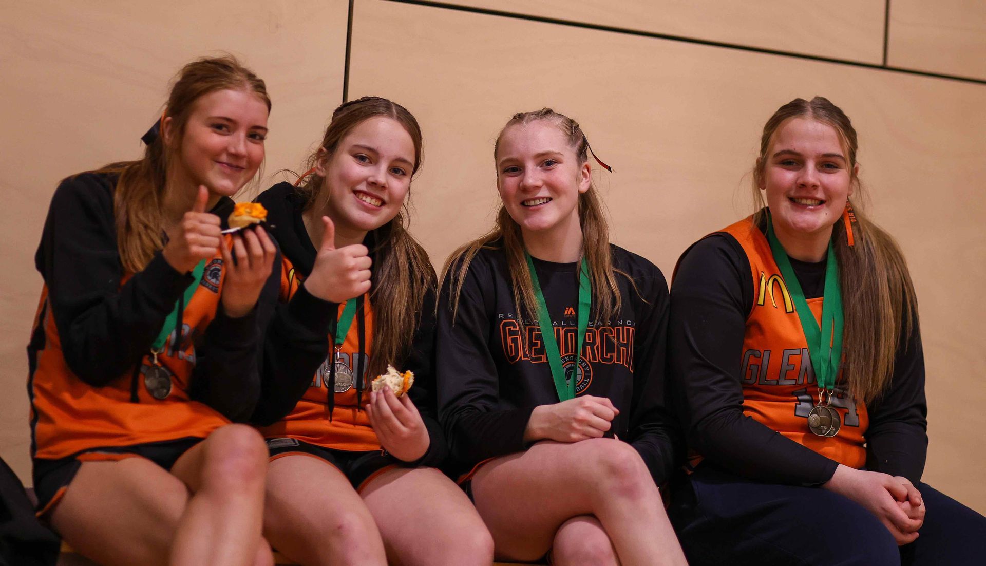 GBA junior girls giving the thumbs up.