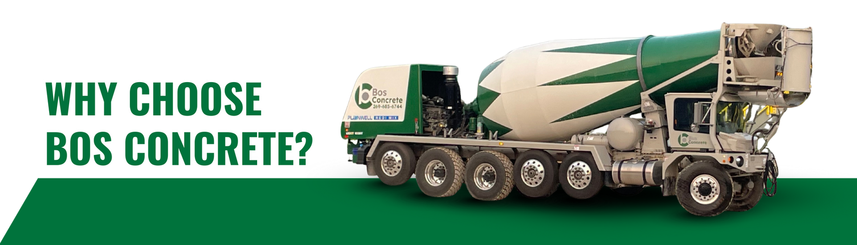 Green and white concrete mixer truck with the text 