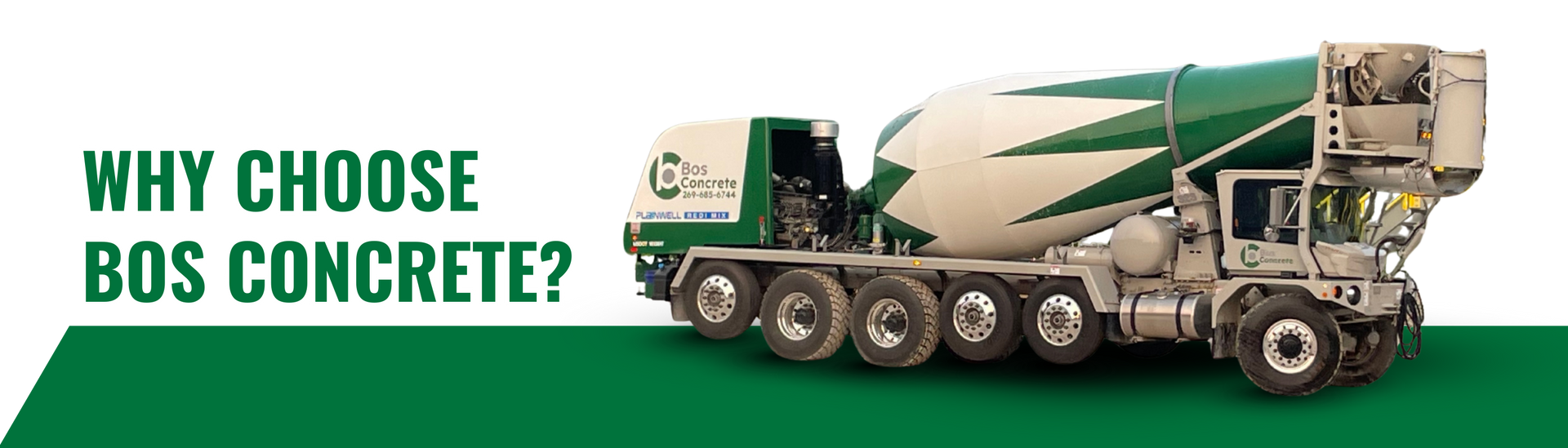 Green and white concrete mixer truck with the text 