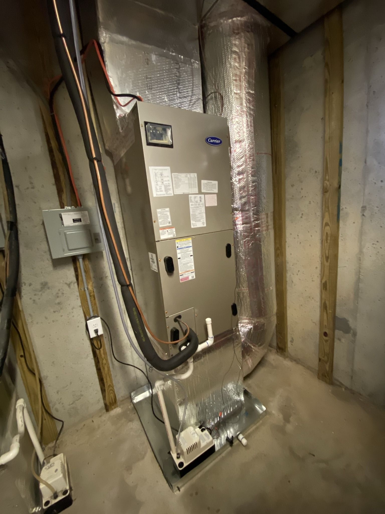 A heating and cooling system is installed in a basement.