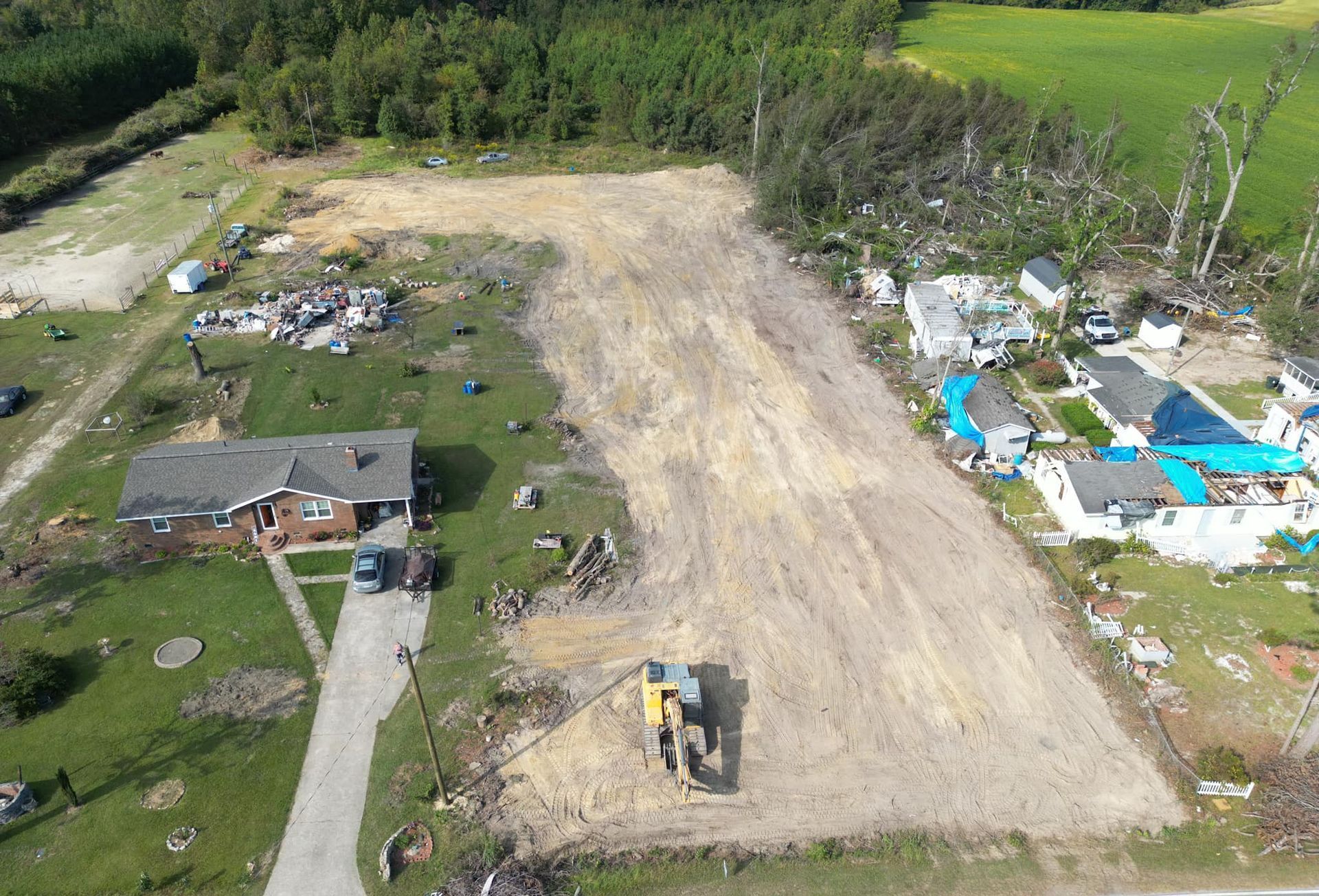 An aerial view of a house that has been damaged by a tornado.