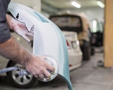 Working with auto parts - Auto collision repair in Butler, PA