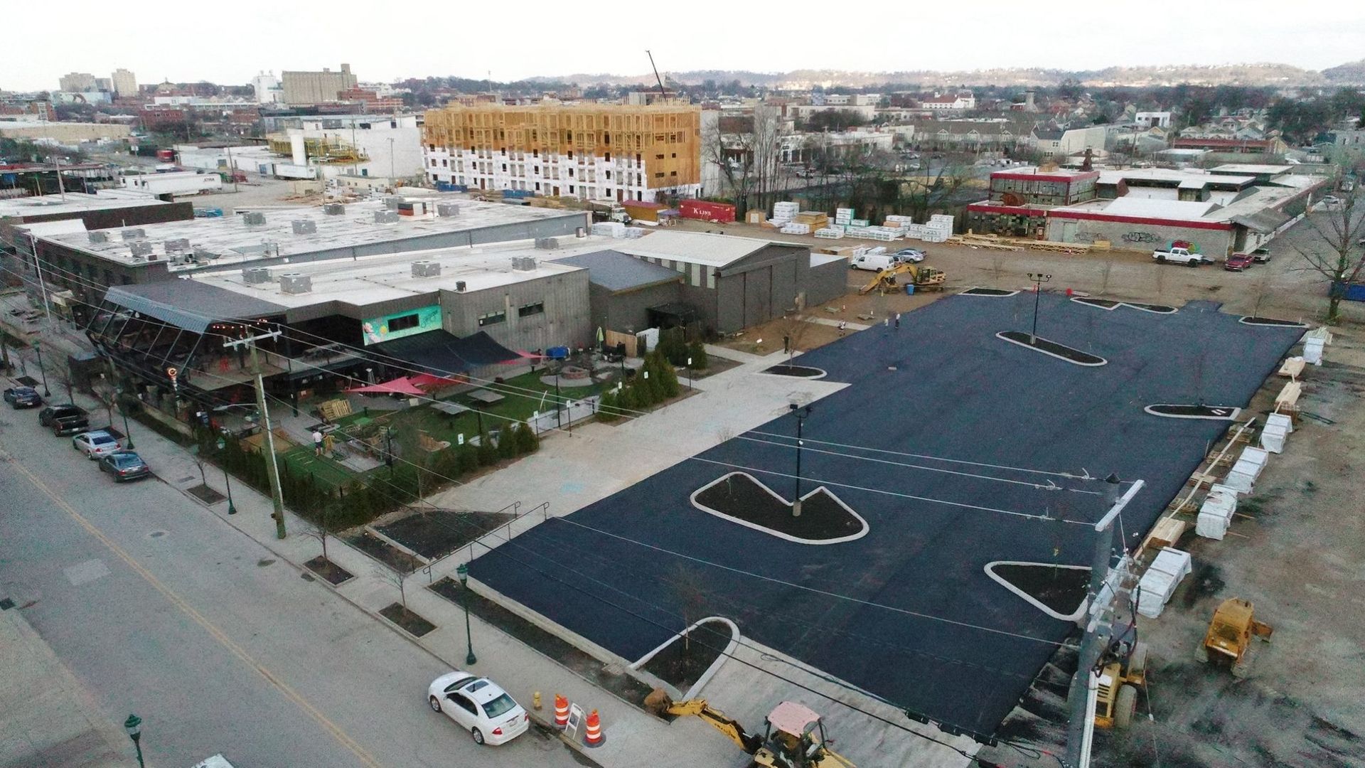 An aerial view of a building under construction in a city