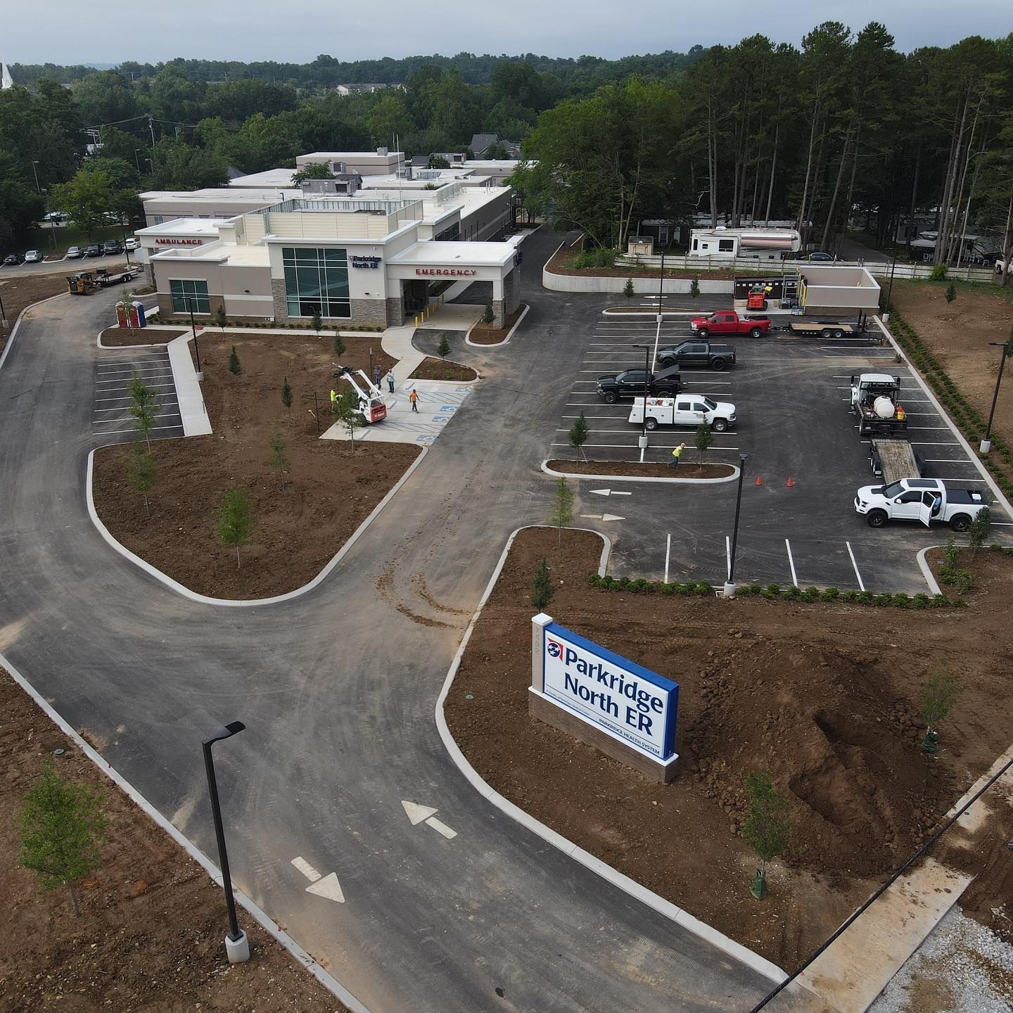 An aerial view of a parking lot with a sign that says parkridge halls of fame
