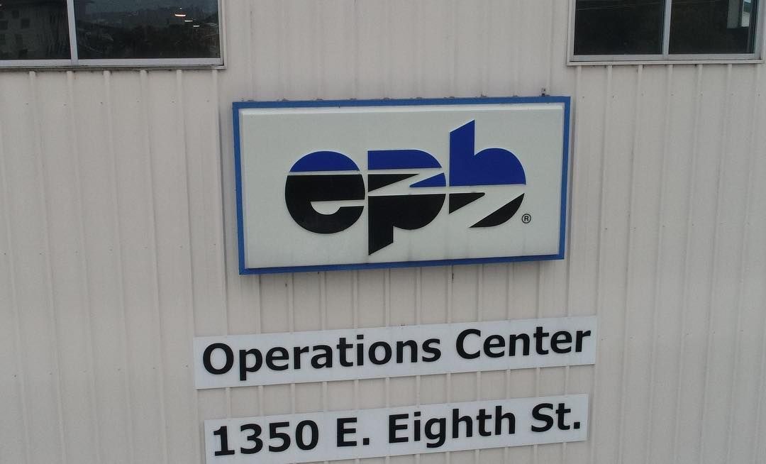 A sign for the operations center is on the side of a building