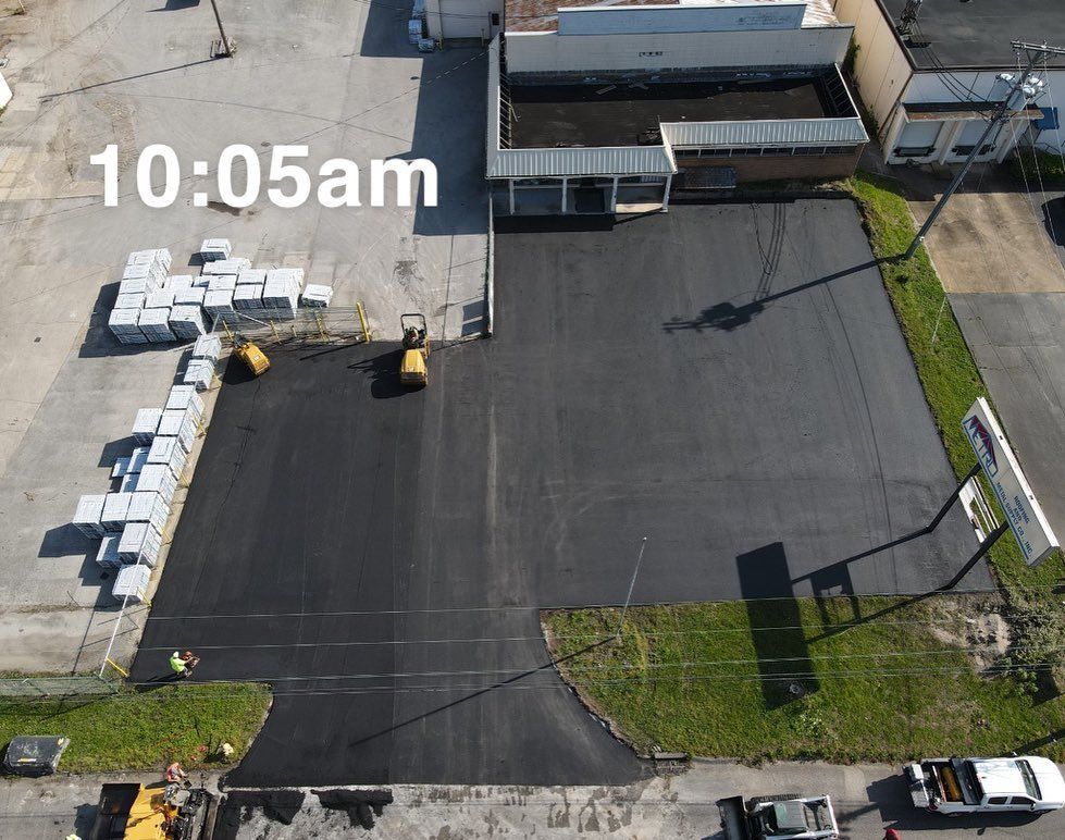 An aerial view of a parking lot at 10:05 am