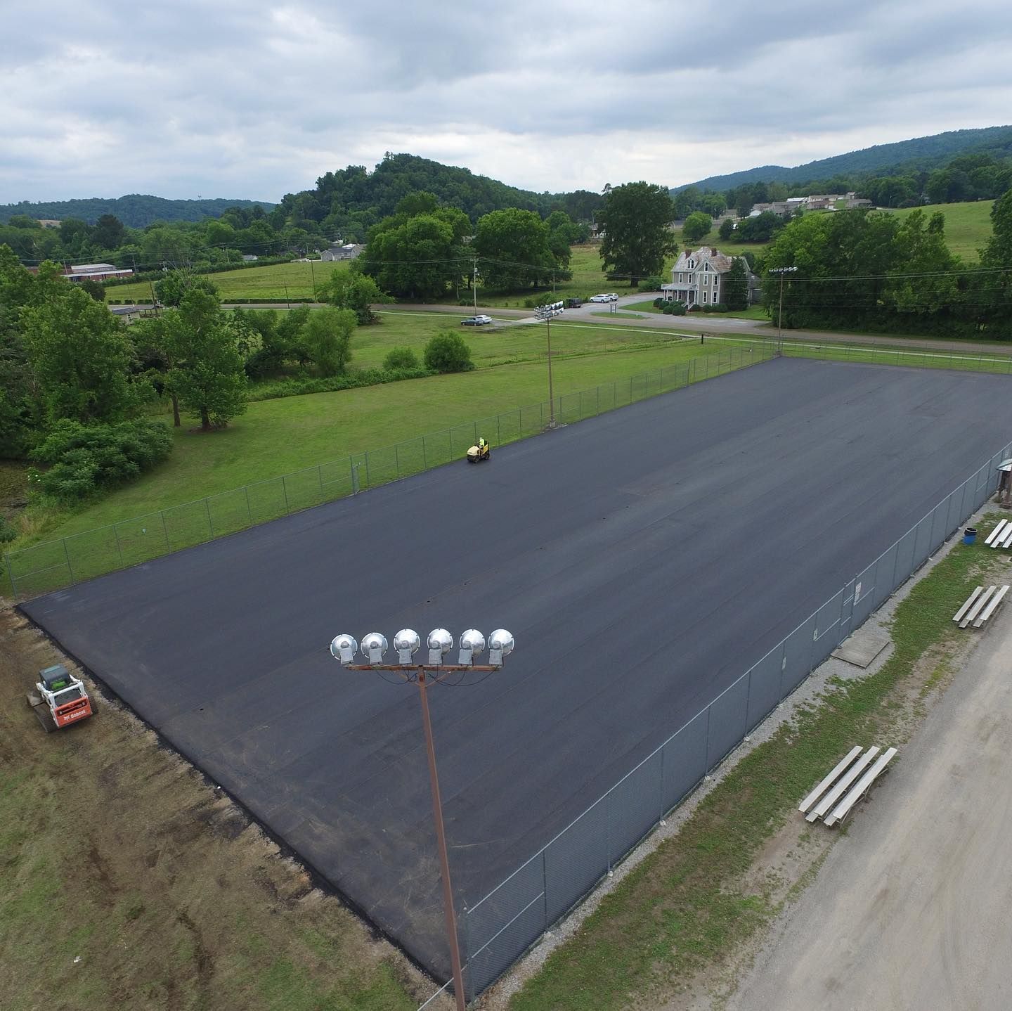 An aerial view of a large asphalt field