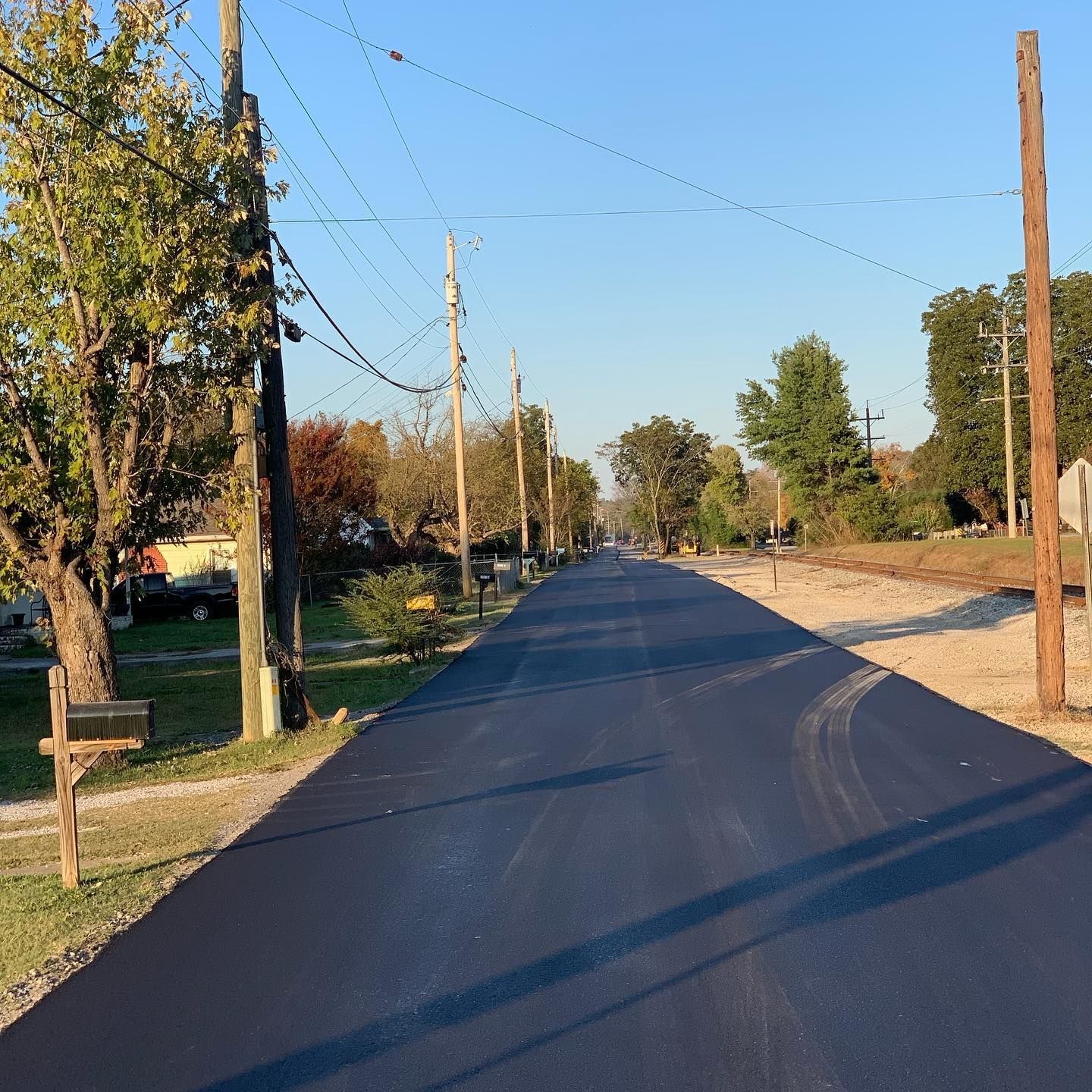 A street with a mailbox on the side of it