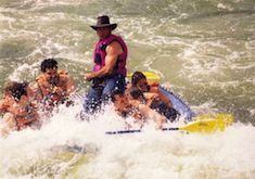 A group of people are rafting down a river.